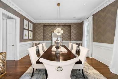 This extraordinary estate in the prestigious Windward community on The Golf Club of Georgia in Georgia - for sale on GolfHomes.com, golf home, golf lot