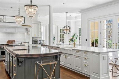 This extraordinary estate in the prestigious Windward community on The Golf Club of Georgia in Georgia - for sale on GolfHomes.com, golf home, golf lot