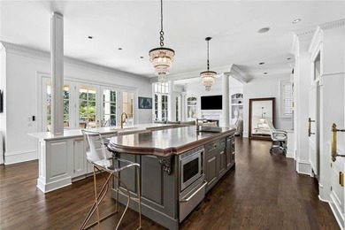 This extraordinary estate in the prestigious Windward community on The Golf Club of Georgia in Georgia - for sale on GolfHomes.com, golf home, golf lot