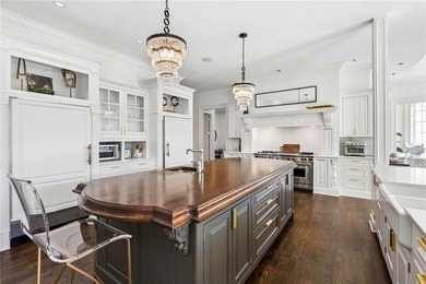 This extraordinary estate in the prestigious Windward community on The Golf Club of Georgia in Georgia - for sale on GolfHomes.com, golf home, golf lot