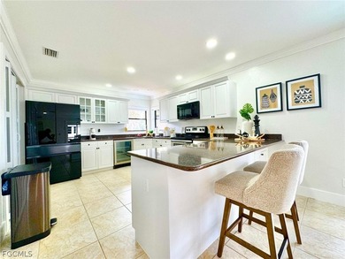 Discover refined living in this exceptional three-story on Alden Pines Golf Club in Florida - for sale on GolfHomes.com, golf home, golf lot