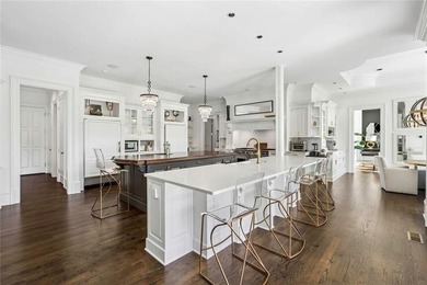 This extraordinary estate in the prestigious Windward community on The Golf Club of Georgia in Georgia - for sale on GolfHomes.com, golf home, golf lot