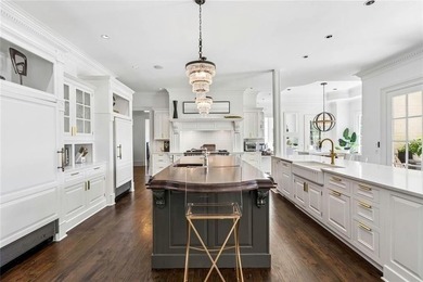 This extraordinary estate in the prestigious Windward community on The Golf Club of Georgia in Georgia - for sale on GolfHomes.com, golf home, golf lot