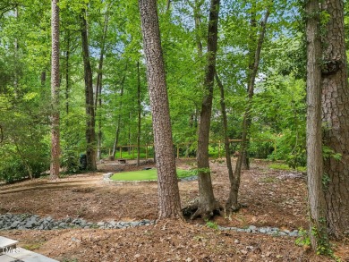 Nestled on a picturesque 1.16-acre lot in the highly on Hope Valley Country Club in North Carolina - for sale on GolfHomes.com, golf home, golf lot