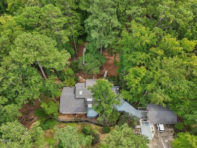 Nestled on a picturesque 1.16-acre lot in the highly on Hope Valley Country Club in North Carolina - for sale on GolfHomes.com, golf home, golf lot