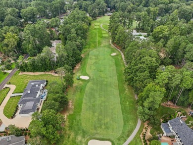 Nestled on a picturesque 1.16-acre lot in the highly on Hope Valley Country Club in North Carolina - for sale on GolfHomes.com, golf home, golf lot