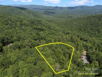 Nestled on 1.2 wooded acres in the gated Kenmure community, this on Kenmure Country Club in North Carolina - for sale on GolfHomes.com, golf home, golf lot