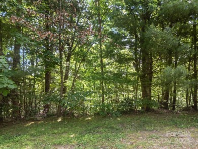 Nestled on 1.2 wooded acres in the gated Kenmure community, this on Kenmure Country Club in North Carolina - for sale on GolfHomes.com, golf home, golf lot