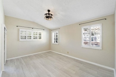 Stunning 3/2  upper corner unit with renovated open kitchen in on Bocaire Country Club in Florida - for sale on GolfHomes.com, golf home, golf lot