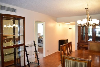 see Matterport Virt tour! Remarkable views to the 17th fairway on Palm-Aire Country Club and Resort - The Oaks in Florida - for sale on GolfHomes.com, golf home, golf lot