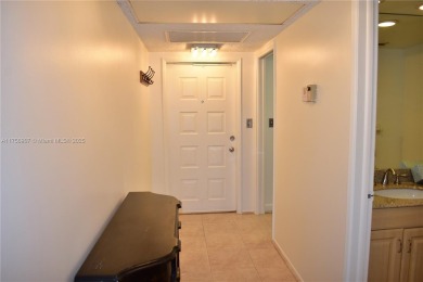 see Matterport Virt tour! Remarkable views to the 17th fairway on Palm-Aire Country Club and Resort - The Oaks in Florida - for sale on GolfHomes.com, golf home, golf lot