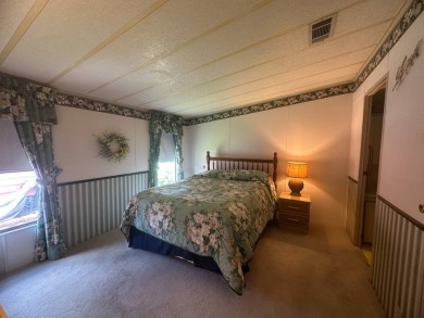 Discover incredible potential in this fully furnished home, ripe on Lake Fairways Country Club in Florida - for sale on GolfHomes.com, golf home, golf lot