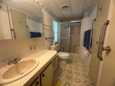 Discover incredible potential in this fully furnished home, ripe on Lake Fairways Country Club in Florida - for sale on GolfHomes.com, golf home, golf lot