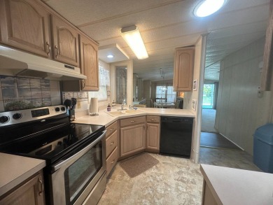 Discover incredible potential in this fully furnished home, ripe on Lake Fairways Country Club in Florida - for sale on GolfHomes.com, golf home, golf lot