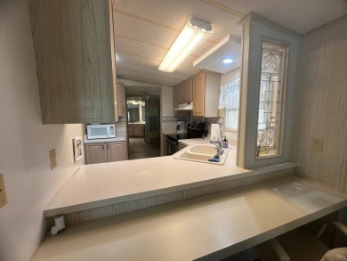 Discover incredible potential in this fully furnished home, ripe on Lake Fairways Country Club in Florida - for sale on GolfHomes.com, golf home, golf lot