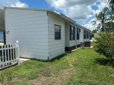 Discover incredible potential in this fully furnished home, ripe on Lake Fairways Country Club in Florida - for sale on GolfHomes.com, golf home, golf lot