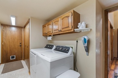 Experience luxury living in this stunning townhouse located on on Pinetop Lakes Golf and Country Club in Arizona - for sale on GolfHomes.com, golf home, golf lot
