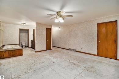 Here is a rare opportunity to own a home within walking distance on Lincoln Hills Golf Club in Michigan - for sale on GolfHomes.com, golf home, golf lot
