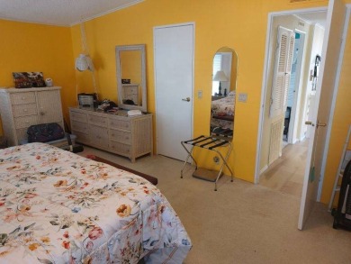 This artistic 2-bedroom 2-bathroom spacious home is located in a on Pine Lakes Country Club in Florida - for sale on GolfHomes.com, golf home, golf lot