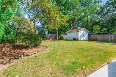 This 3-bedroom, 2-bath brick bungalow blends timeless character on College Park Municipal Golf Course in Georgia - for sale on GolfHomes.com, golf home, golf lot