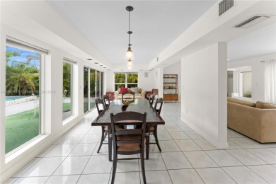Beautiful light and bright pool home in a gated residential golf on Normandy Shores Golf Course in Florida - for sale on GolfHomes.com, golf home, golf lot