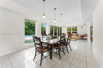 Beautiful light and bright pool home in a gated residential golf on Normandy Shores Golf Course in Florida - for sale on GolfHomes.com, golf home, golf lot