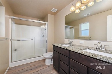 This inviting home features soaring vaulted ceilings upgraded on Hunters Point Golf Club in Idaho - for sale on GolfHomes.com, golf home, golf lot