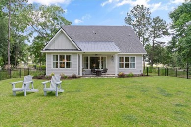 This one of a kind home is nestled between the #1 putting green on The Golf Club At Sanctuary Cove in Georgia - for sale on GolfHomes.com, golf home, golf lot