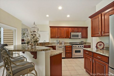 Welcome to this immaculately maintained home in the lovely gated on Boulder Ridge Country Club in Illinois - for sale on GolfHomes.com, golf home, golf lot