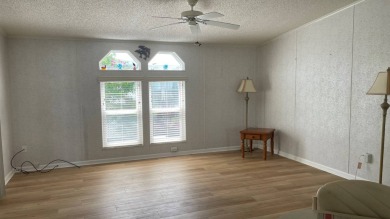 This home is located in the upscale 55+ gated community - The on Sabal Springs Golf and Racquet Club in Florida - for sale on GolfHomes.com, golf home, golf lot