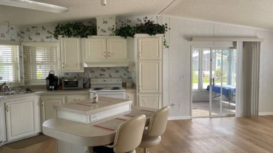 This home is located in the upscale 55+ gated community - The on Sabal Springs Golf and Racquet Club in Florida - for sale on GolfHomes.com, golf home, golf lot