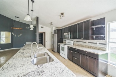 Charming 3BR/2BA home in Oakwood Golf Club! Built in 2002, this on Oakwood Golf Club in Florida - for sale on GolfHomes.com, golf home, golf lot