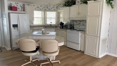 This home is located in the upscale 55+ gated community - The on Sabal Springs Golf and Racquet Club in Florida - for sale on GolfHomes.com, golf home, golf lot