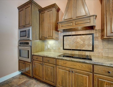 Custom Craftsman-style home with an open floor plan, cathedral on Granada Golf Course in Arkansas - for sale on GolfHomes.com, golf home, golf lot