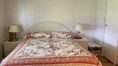 This home is located in the upscale 55+ gated community - The on Sabal Springs Golf and Racquet Club in Florida - for sale on GolfHomes.com, golf home, golf lot