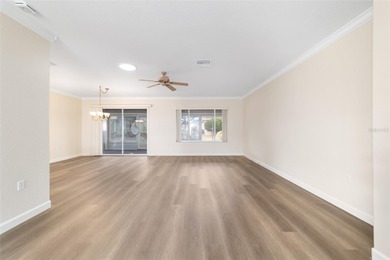 Welcome home and step into this popular Sanibel model on Eagle Ridge At Spruce Creek Country Club in Florida - for sale on GolfHomes.com, golf home, golf lot