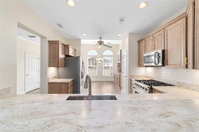 Welcome home and step into this popular Sanibel model on Eagle Ridge At Spruce Creek Country Club in Florida - for sale on GolfHomes.com, golf home, golf lot