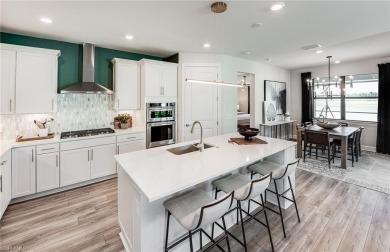 This stunning Mystique Plan Home located in highly desirable on Valencia Golf and Country Club in Florida - for sale on GolfHomes.com, golf home, golf lot
