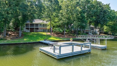 Discover timeless Southern elegance and luxury lakefront living on Great Waters Course At Reynolds Plantation in Georgia - for sale on GolfHomes.com, golf home, golf lot