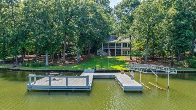 Discover timeless Southern elegance and luxury lakefront living on Great Waters Course At Reynolds Plantation in Georgia - for sale on GolfHomes.com, golf home, golf lot