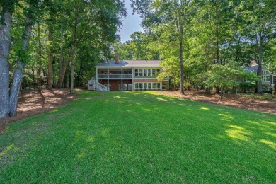 Discover timeless Southern elegance and luxury lakefront living on Great Waters Course At Reynolds Plantation in Georgia - for sale on GolfHomes.com, golf home, golf lot