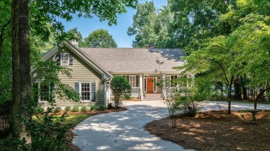 Discover timeless Southern elegance and luxury lakefront living on Great Waters Course At Reynolds Plantation in Georgia - for sale on GolfHomes.com, golf home, golf lot