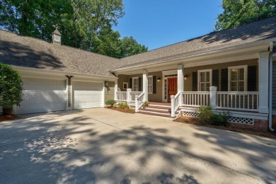 Discover timeless Southern elegance and luxury lakefront living on Great Waters Course At Reynolds Plantation in Georgia - for sale on GolfHomes.com, golf home, golf lot