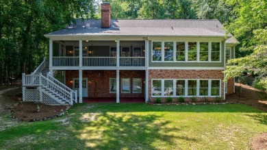Discover timeless Southern elegance and luxury lakefront living on Great Waters Course At Reynolds Plantation in Georgia - for sale on GolfHomes.com, golf home, golf lot