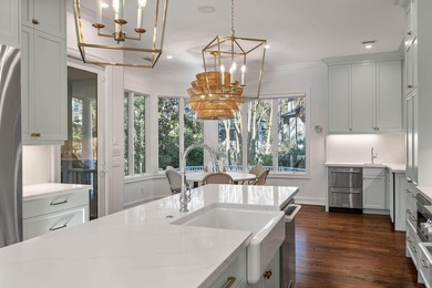 Set on a generous, level homesite overlooking a tranquil lagoon on Kiawah Island Resort - Cougar Point in South Carolina - for sale on GolfHomes.com, golf home, golf lot