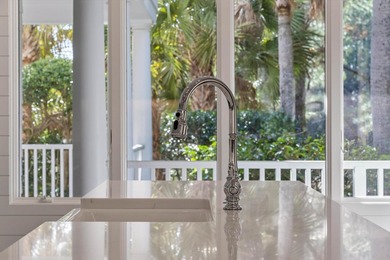 Set on a generous, level homesite overlooking a tranquil lagoon on Kiawah Island Resort - Cougar Point in South Carolina - for sale on GolfHomes.com, golf home, golf lot