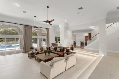 Stunning golf and lake views and beautifully updated grounds are on Isleworth Golf and Country Club in Florida - for sale on GolfHomes.com, golf home, golf lot
