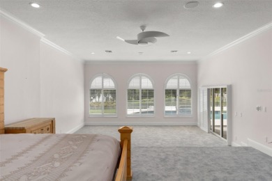 Stunning golf and lake views and beautifully updated grounds are on Isleworth Golf and Country Club in Florida - for sale on GolfHomes.com, golf home, golf lot
