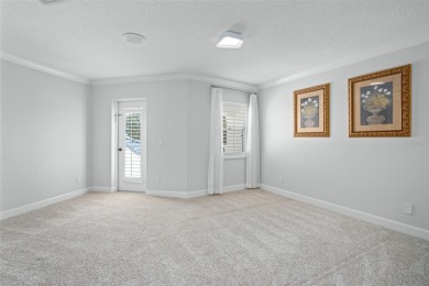Stunning golf and lake views and beautifully updated grounds are on Isleworth Golf and Country Club in Florida - for sale on GolfHomes.com, golf home, golf lot