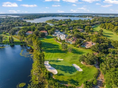 Stunning golf and lake views and beautifully updated grounds are on Isleworth Golf and Country Club in Florida - for sale on GolfHomes.com, golf home, golf lot